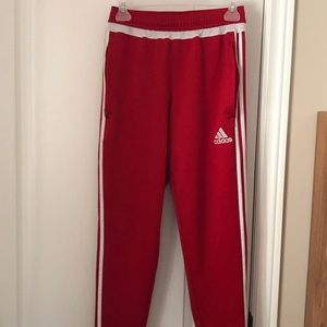 Red Adidas sweatpants
